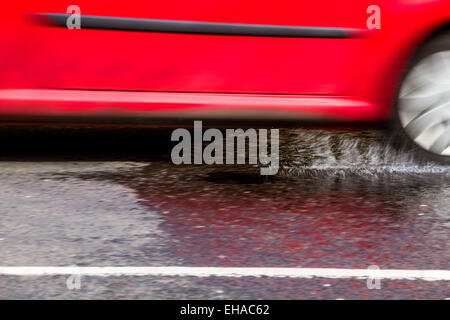 Scottish Drivers struggling to cope with pothole problems along Dens Road in Dundee, UK Stock Photo