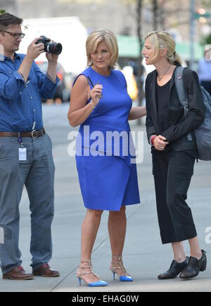 Diane Sawyer conducts an interview while out walking in New York City