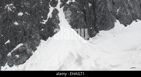 Snow-filled gully and snow-covered Glacier Noir glacier in the Ecrins National Park, French Alps. Stock Photo