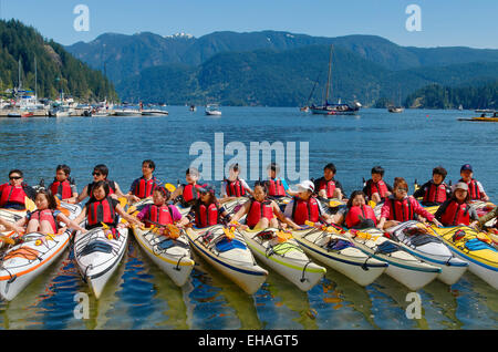 Teen novice kayakers get training , Deep Cove, District of North Vancouver, British Columbia, Canada Stock Photo