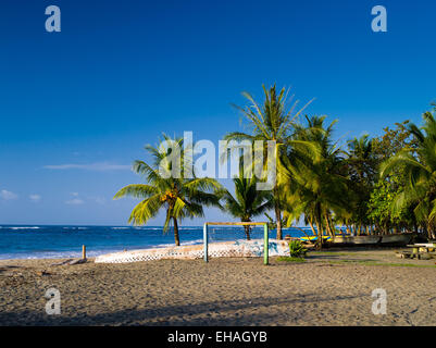 The sun sets at the beach at Manzanillo, Limon, Costa Rica. Stock Photo