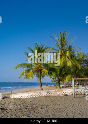 The sun sets at the beach at Manzanillo, Limon, Costa Rica. Stock Photo