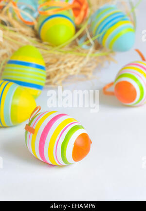 Easter eggs in nest and white background Stock Photo