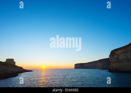 Mediterranean Europe, Malta, Gozo Island, resort town of Xlendi,  Torri ta'Xlendi 17th century watchtower at sunset Stock Photo