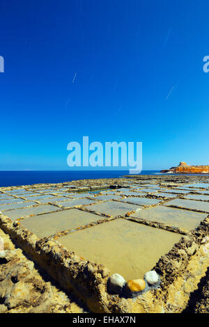 Mediterranean Europe, Malta, Gozo Island, night shot of salt pans at Xwejni Bay Stock Photo