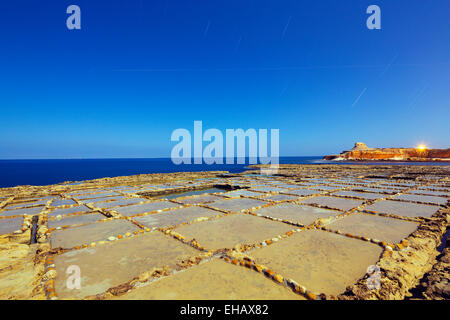 Mediterranean Europe, Malta, Gozo Island, night shot of salt pans at Xwejni Bay Stock Photo