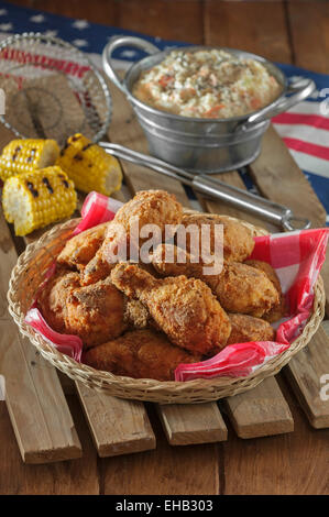 Southern fried chicken with coleslaw and grilled corn Stock Photo