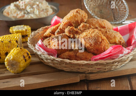 Southern fried chicken with coleslaw and grilled corn Stock Photo