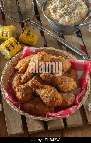 Southern fried chicken with coleslaw and grilled corn Stock Photo