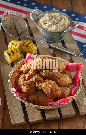 Southern fried chicken with coleslaw and grilled corn Stock Photo