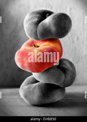 still life of a sick of fresh donut peaches Stock Photo
