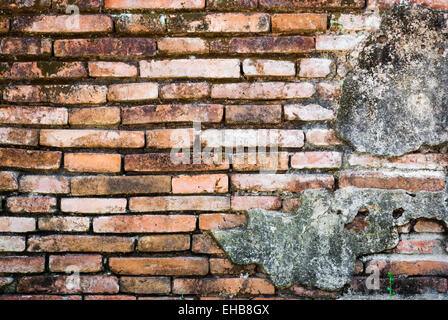 Old Deformed Brick Wall Background/Texture. Stock Photo