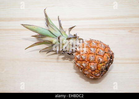 the fresh pineapple on the wooden table Stock Photo