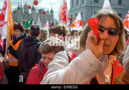 Schwerin, Germany. 11th Mar, 2015. A teacher participates in the central rally of the unions GEW, Verdi and GdP, together with thousands of employees in the civil service in front of the State Chancellery and Schwerin Palace, in Schwerin, Germany, 11 March 2015. The educational union GEW alone had called upon around 10,000 hired teachers in around 600 schools to participate in strike actions. The unions demand 5.5 percent higher wages, but at least 175 euros more, among other things. Photo: Jens Buettner/dpa/Alamy Live News Stock Photo
