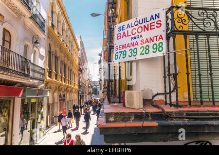 Seville Spain Sevilla. Sign balcony for rent in the run-up to the Semana Santa procession on Calle Sierpes main shopping street. Stock Photo