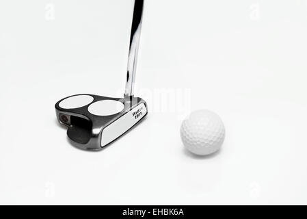 Odyssey White Hot Golf Putter and Golf Ball on White background Stock Photo