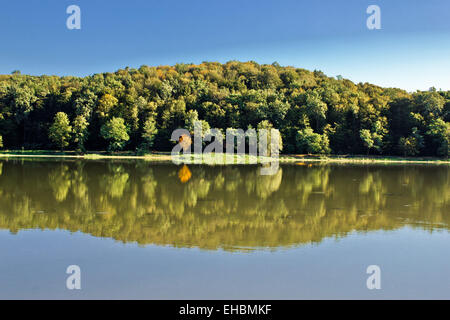 Idyllic autumn reflections on lake surface Stock Photo