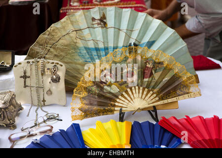 Argentina, Buenos Aires, San Telmo Sunday street market, antique fans on bric a brac stall Stock Photo