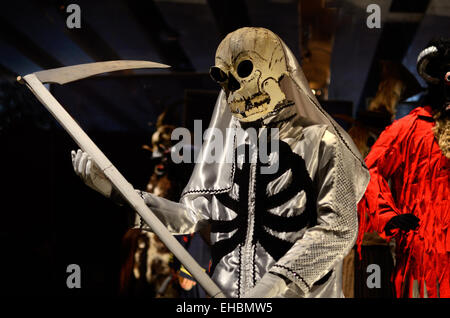 Death Costume Grim Reaper Devil or Satan with Scythe from Zielonki Carnival Poland Stock Photo