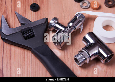 Professional plumbing tools and seals placed in the workplace. Stock Photo