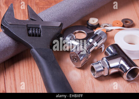 Professional plumbing tools and seals placed in the workplace. Stock Photo