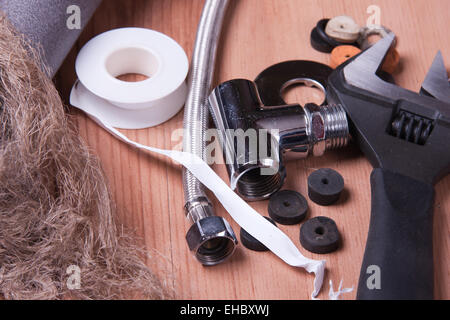 Professional plumbing tools and seals placed in the workplace. Stock Photo