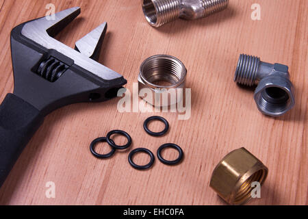 Professional plumbing tools and seals placed in the workplace. Stock Photo