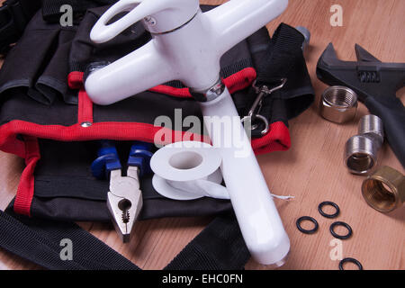 Professional plumbing tools and seals placed in the workplace. Stock Photo