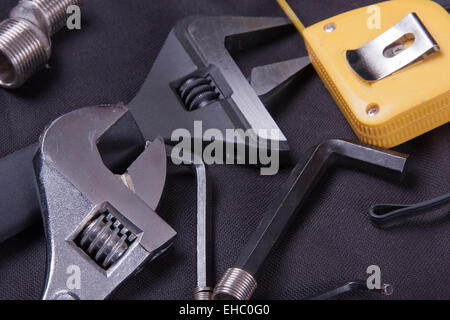Professional plumbing tools and seals placed in the workplace. Stock Photo
