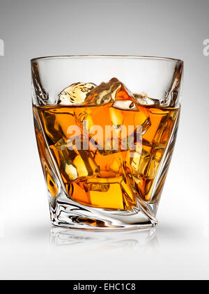 Glass of whiskey on a gray background Stock Photo