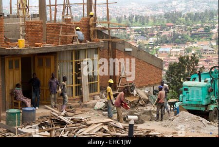 KIGALI, RWANDA - NOVEMBER 14, 2013: Unidentified men at work in the construction of a building in Kigali Stock Photo