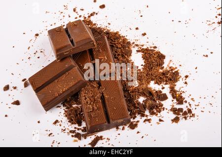 Raw dark chocolate bars on white background Stock Photo