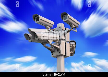 security surveillance camera on blue sky with motion effect Stock Photo