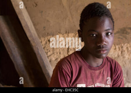 Komobangau gold mines, Niger; Samaila Ibrahim, 15, works extracting gold from low-grade ore.  He can earn up to $100 in a good month. Stock Photo