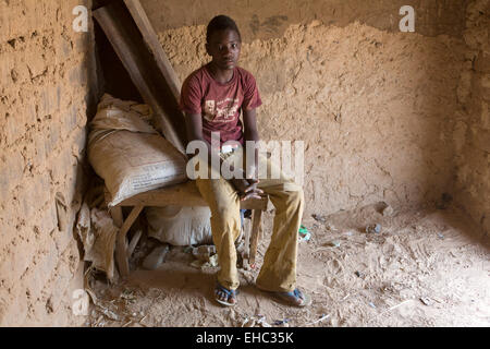 Komobangau gold mines, Niger; Samaila Ibrahim, 15, works extracting gold from low-grade ore.  He can earn up to $100 in a good month. Stock Photo