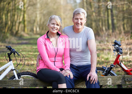 Mature Couple On Cycle Ride In Countryside Together Stock Photo