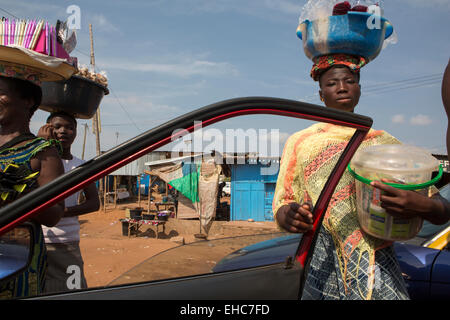 LOME, TOGO, 9th December 2012; Street sellers with food and goods Stock Photo