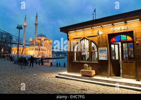 Night view of Ortakoy port with Ortakoy Mosque and Bosphorus Bridge background in Istanbul, Turkey Stock Photo