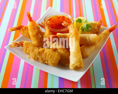 Deep fried breaded chinese prawns with a sweet chili dip Stock Photo