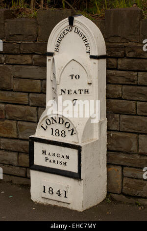 Mile Stone on Margam Road in the Parish of Margam in Port Talbot, Wales, UK, giving the distance to Pyle, Neath and London Stock Photo