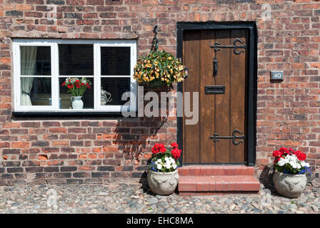 Pretty Cottage Front Door in Summer on Church Street, Great Budworth, Cheshire, England, UK