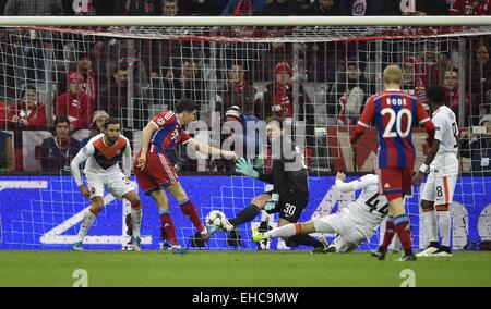 Allianz Stadium, Munich, Germany. 11th Mar, 2015. UEFA Champions League football. Bayern Munich versus Shakhtar Donetsk. Robert Lewandowski FC Bayern Munich shoots past keeper Andriy Pyatov FC Shakhtar Donetsk The game ended 7-0 to Bayern over Shakhtar. Credit:  Action Plus Sports/Alamy Live News Stock Photo