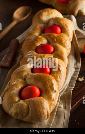 Homemade Greek Easter Bread with Red Eggs Stock Photo