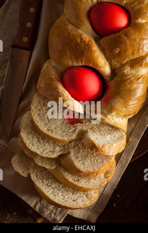 Homemade Greek Easter Bread with Red Eggs Stock Photo