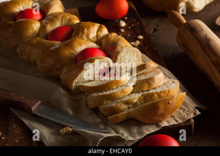 Homemade Greek Easter Bread with Red Eggs Stock Photo