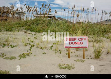 A sign reminds beach visitors that the dunes are a fragile eco-system Stock Photo