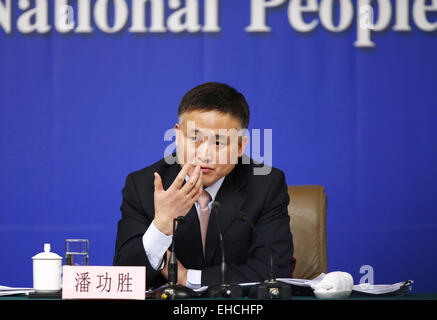 (150312) -- BEIJING, March 12, 2015 (Xinhua) -- Pang Gongsheng, deputy governor of the People's Bank of China (PBC), answers questions at a press conference for the third session of the 12th National People's Congress (NPC) on financial reform in Beijing, capital of China, March 12, 2015. (Xinhua/Yin Gang) (yxb) Stock Photo