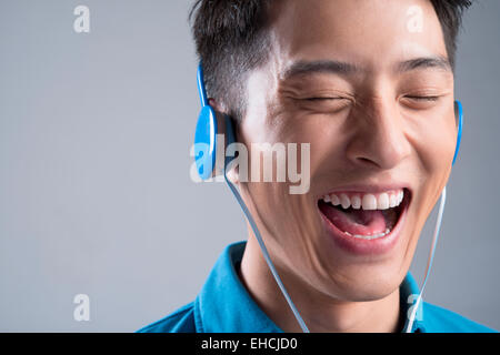 Young man listening to music Stock Photo