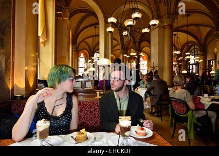 Young couple sitting at a table in the traditional Café Central, Innere Stadt district, Vienna, Austria Stock Photo