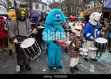 Sesame street characters with the Cookie Monster, costumes of Guggenmusig Födlitätscher, traditional carnival celebrations in Stock Photo